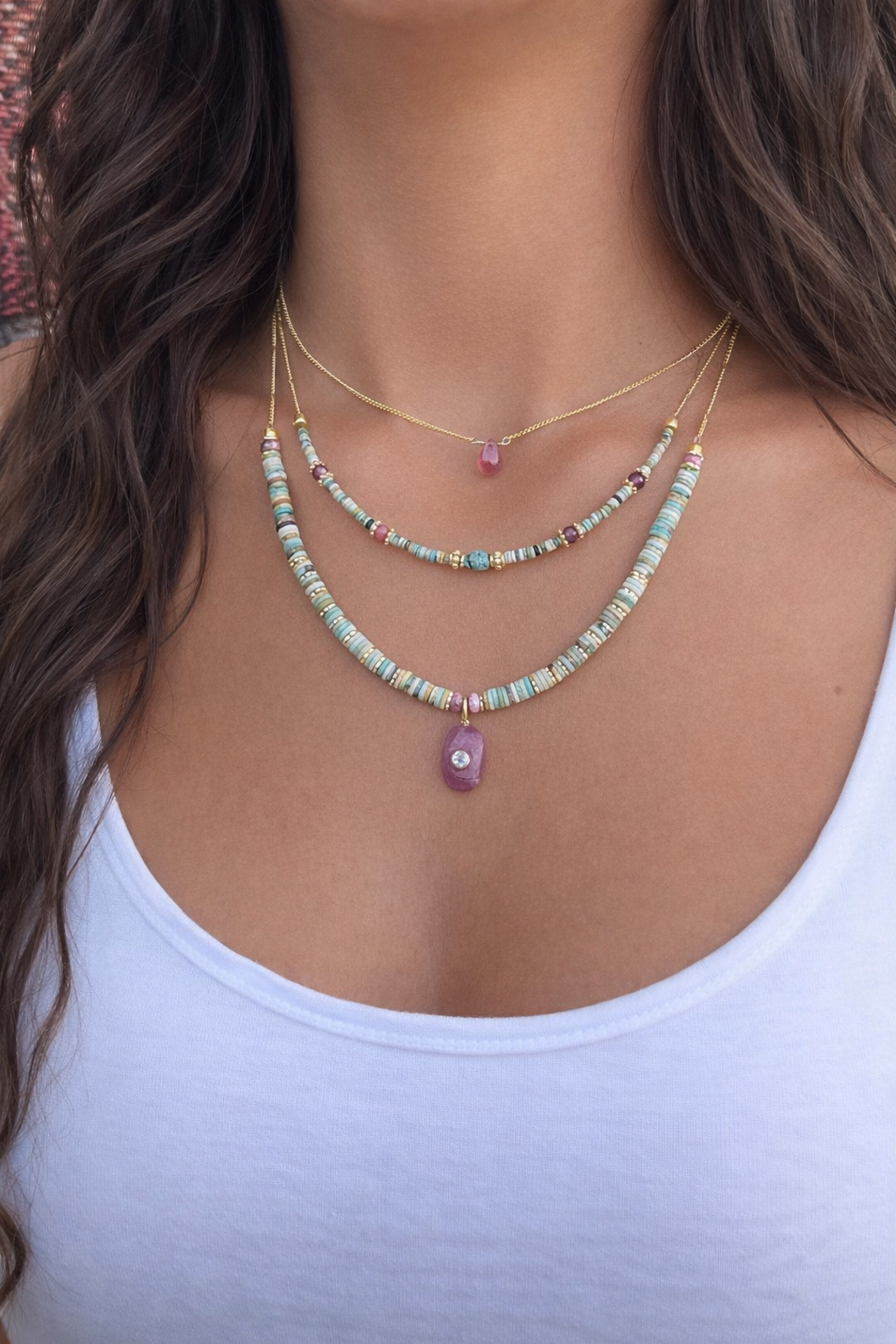 Decretos y afirmaciones turquesas con dije de Rubí